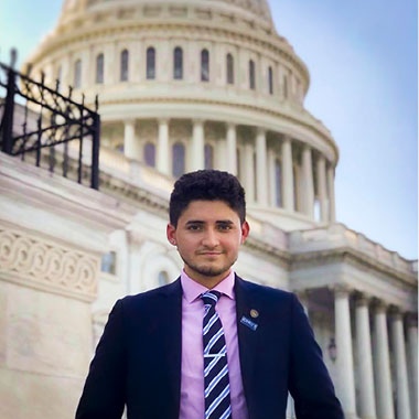 Lenni Joya ’19 standing in front of a US government building
